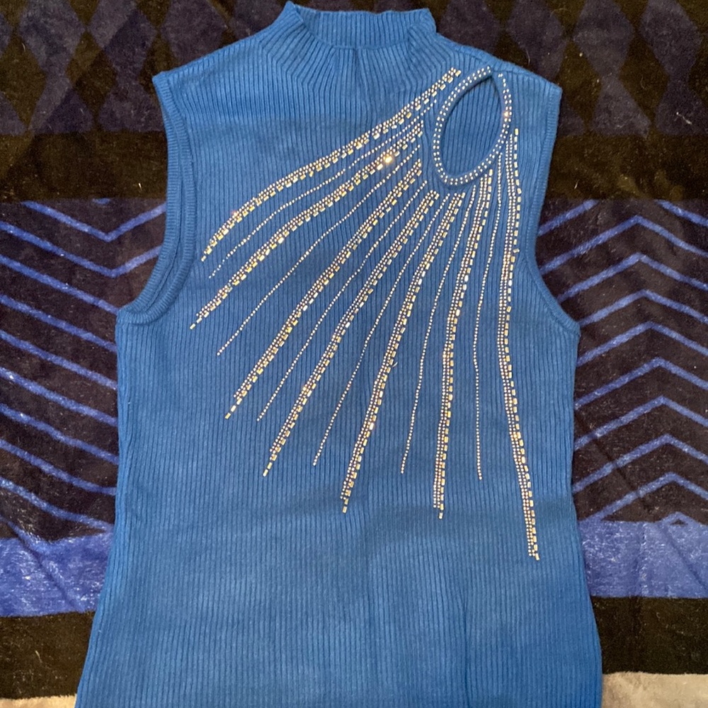 Blue blouse with beading in front and peek a boo peep hole
